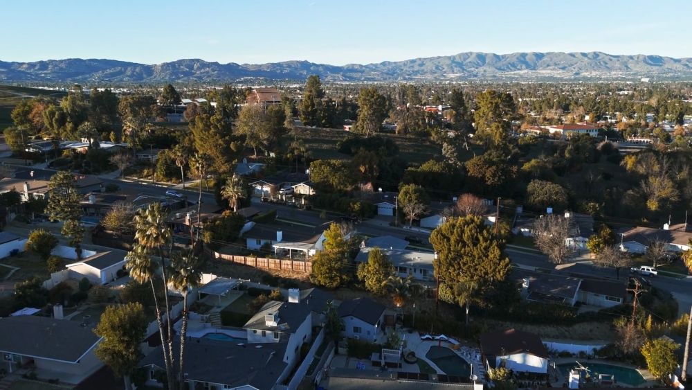 Aerial view of residential neighborhoods in Reno with mountains in the background